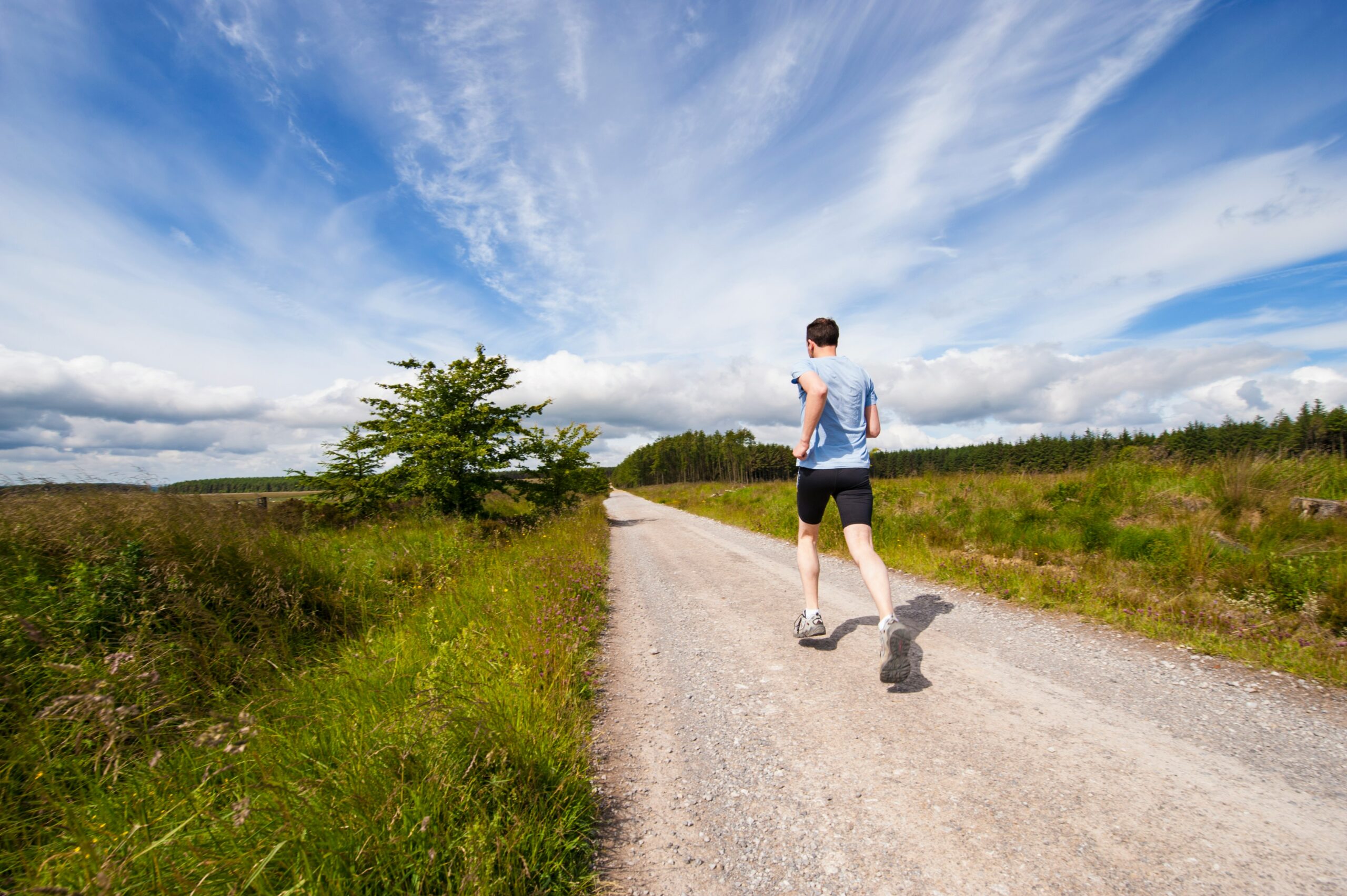 A runner on a bright open road